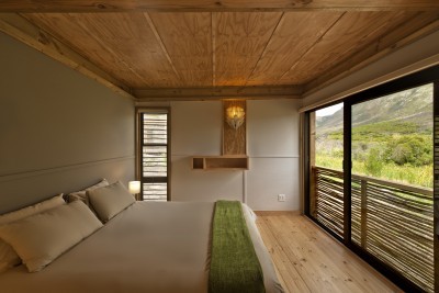 Cabin bedroom with unobstructed views of the landscape