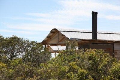 Gently curving roofs soften the visual impact of the buildings in the landscape